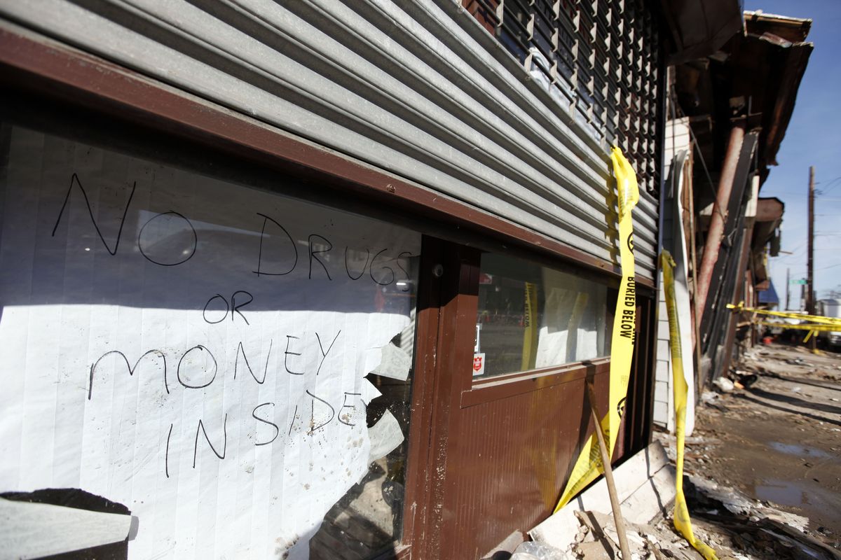 A sign proclaiming a lack of valuables inside is posted in the door of a veterinary clinic on a storm and fire ravaged block in Rockaway Beach, Tuesday, Nov. 6, 2012, in the the Queens borough of New York. Weather experts have some good news for beleaguered coastal residents in the Northeast: A new storm that threatened to complicate Hurricane Sandy cleanup efforts now looks like it will be weaker than expected. (Jason Decrow / Fr103966 Ap)