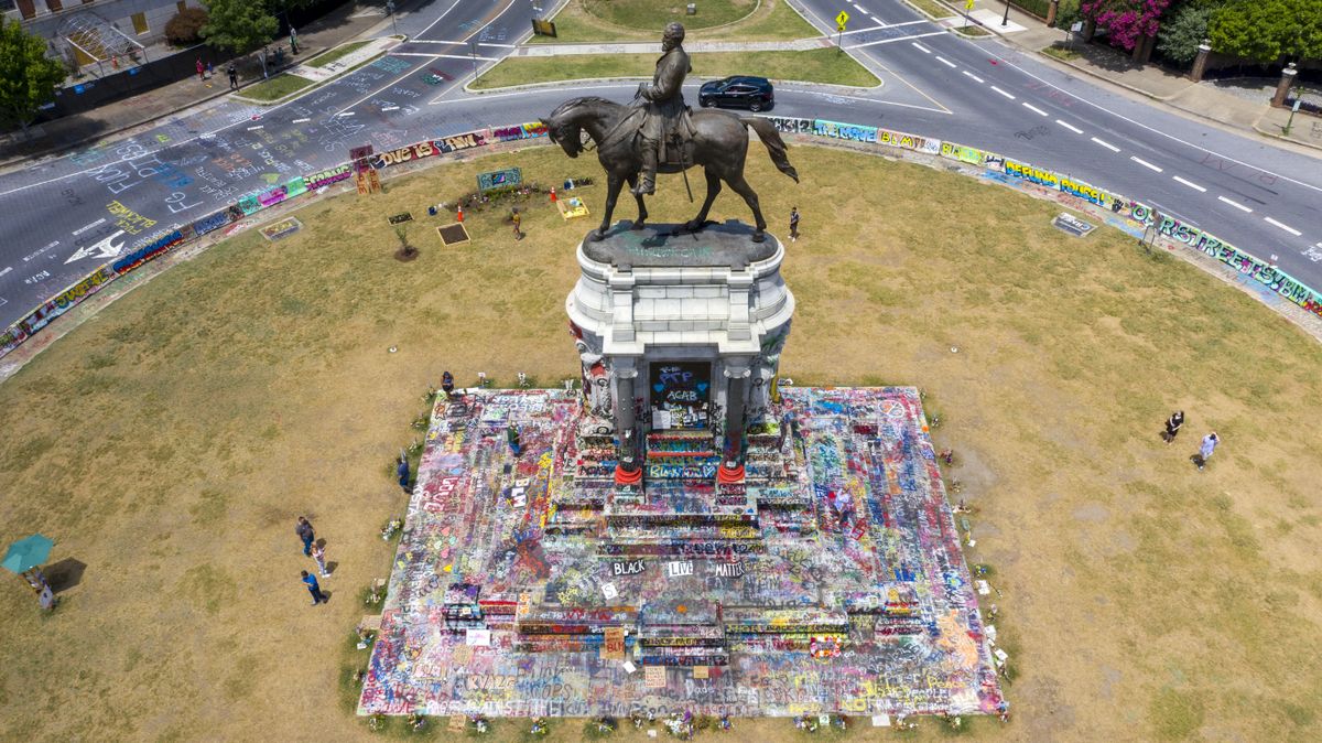 EDS NOTE: OBSCENITY - FILE - In this Friday, July 10, 2020, file photo is the statue of Confederate General Robert E. Lee on Monument Avenue in Richmond, Va. The Supreme Court of Virginia is set to hear arguments Tuesday, June 8, 2021, in legal challenges to Virginia Gov. Ralph Northam