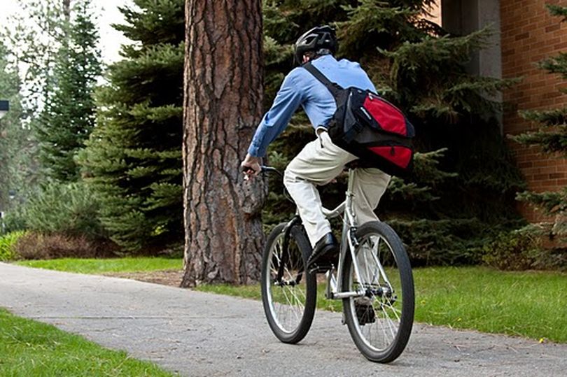 Vincent Kramer bikes to his job at The Thinkery in Coeur d'Alene.  Both Coeur d'Alene and Spokane will offer activities and incentives later this month for residents to explore commuting on two wheels. (Ian Kramer / Down to Earth NW Correspondent)