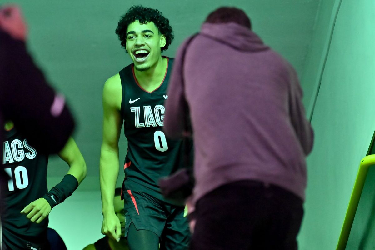 Gonzaga Bulldogs guard Julian Strawther (0) smiles as he heads to the court to face the San Francisco Dons during the first half of a college basketball game on Thursday, Feb 24, 2022, at War Memorial Gym in San Francisco, Calif.  (Tyler Tjomsland/The Spokesman-Review)