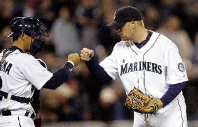 
Seattle catcher Kenji Johjima and reliever J.J. Putz enjoy a win.
 (Associated Press / The Spokesman-Review)