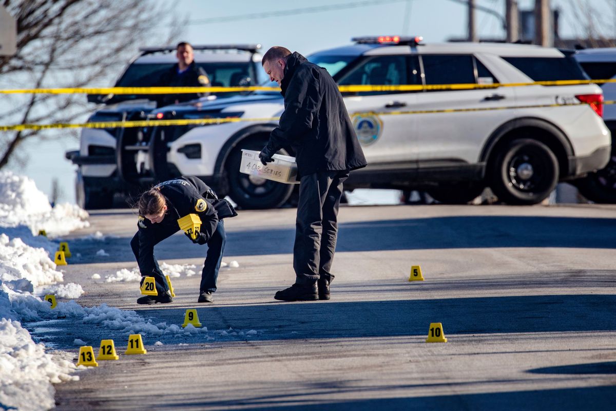 Police investigate a shooting outside of East High School in in Des Moines, Iowa, on Monday.  (Zach Boyden-Holmes)