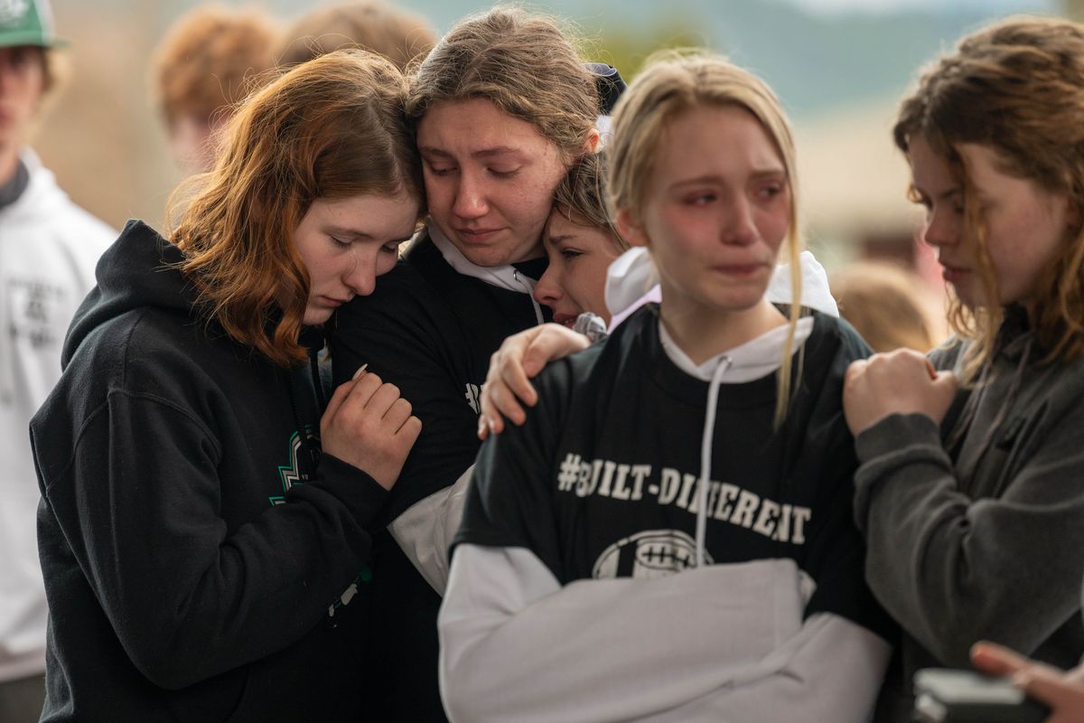 Colville High School students, and members of the community gather Saturday outside of Providence Mount Carmel Hospital to grieve the loss of Dale Martin who was being taken off life support and having his organs donated after he suffered a traumatic football injury during a game, April 1, 2021. (COLIN MULVANY/THE SPOKESMAN-REVIEW)