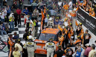 
Tony Stewart raises his arms in celebration after winning the NASCAR Nextel Cup Series' Centurian Boats race. Associated Press
 (Associated Press / The Spokesman-Review)
