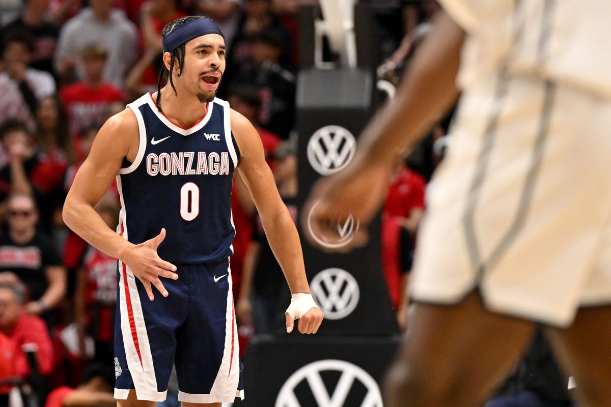 Gonzaga Bulldogs guard Ryan Nembhard (0) cheers after guard Dusty Stromer (4) hit a three against the San Diego State Aztecs during the first half of a college basketball game on Monday, Nov. 18, 2024, at Viejas Arena in San Diego, Calif. 