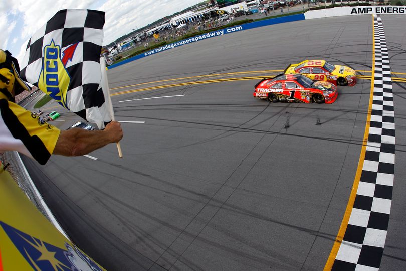 Kevin Harvick beats Jamie McMurray to the finish line by .011 seconds, the eighth-closest margin since the advent of electronic scoring in 1993, to win the Aaron's 499 at Talladega Superspeedway. (Photo courtesy  Todd Warshaw/Getty Images) (Todd Warshaw / Getty Images North America)