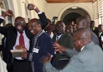 Members of Zimbabwe’s opposition party Movement for Democratic Change  celebrate after their colleague Lovemore Moyo was elected speaker of Parliament in Harare on Monday.  (Associated Press / The Spokesman-Review)