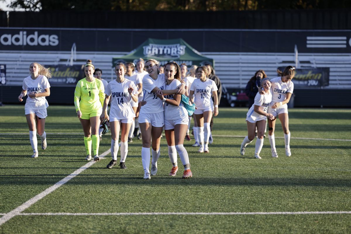 CC Spokane women’s soccer players Delaney Lamotte, left, and Alexa Deatherage embrace as they leave the field after winning the NWAC championship in Tukwila, Washington, on Nov. 13.  (Courtesy/Daniel Acosta)