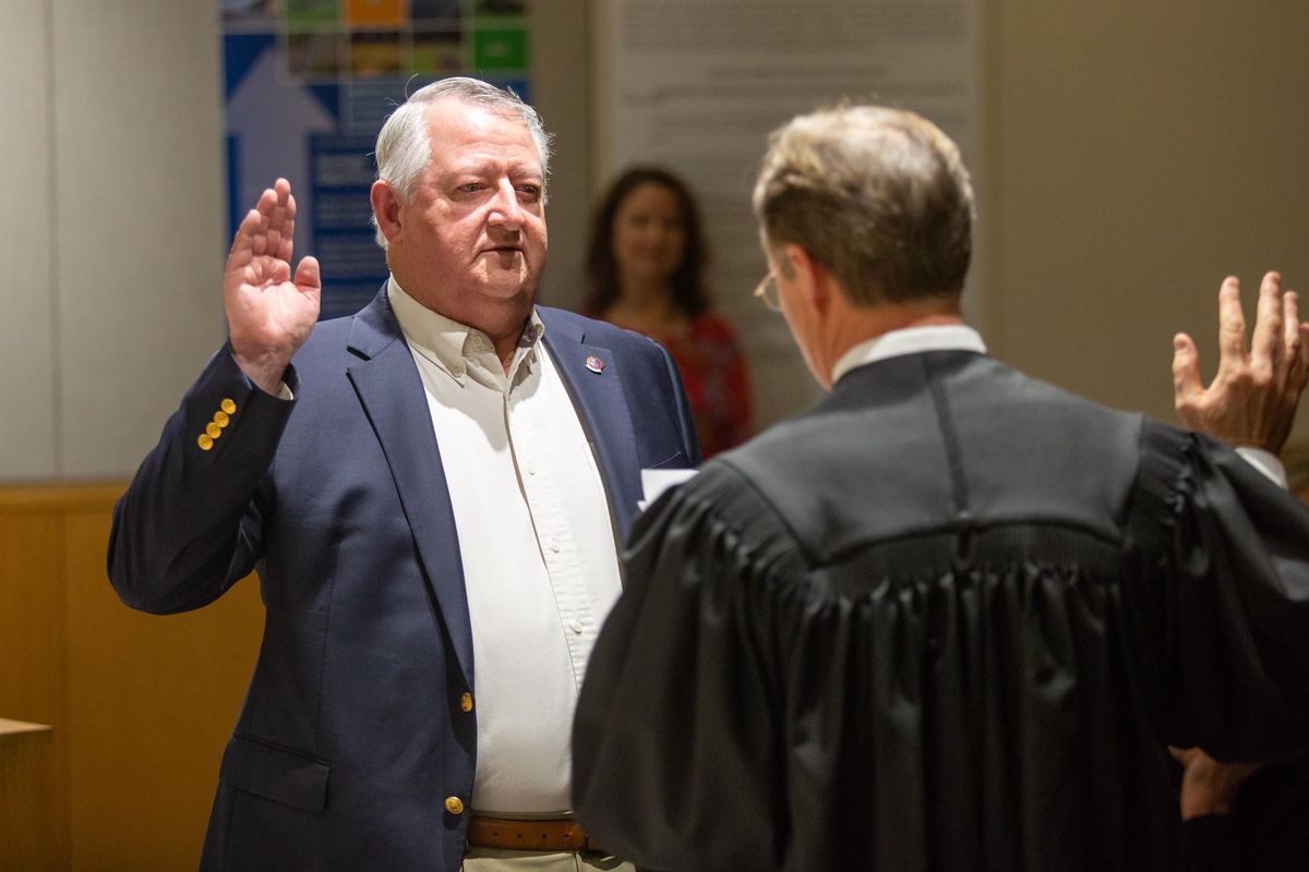 Al French takes the oath of office during his swearing-in ceremony at the Spokane County Public Works building on Nov. 27, 2018. French was re-elected  to a third term as county commissioner, District 3. (Libby Kamrowski / The Spokesman-Review)
