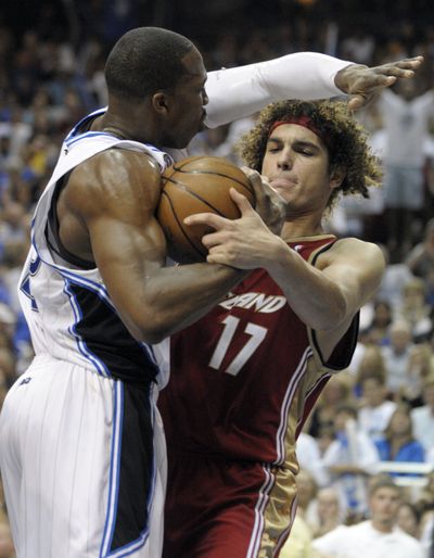 Magic’s Dwight Howard and Cavs’ Anderson Varejao battle for a rebound in fourth quarter.  (Associated Press / The Spokesman-Review)