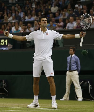 Novak Djokovic didn’t let a sore left arm slow him in another Wimbledon win, this time over France’s Jo-Wilfried Tsonga. (Associated Press)