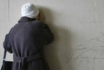 
A woman cries at a wall of the Moscow theater Tuesday, where 800 people were taken hostage Oct. 23, 2002. The siege at the theater lasted 60 hours and left 129 hostages dead, mostly from a narcotic gas Russian forces used to subdue the attackers. 
 (Associated Press / The Spokesman-Review)