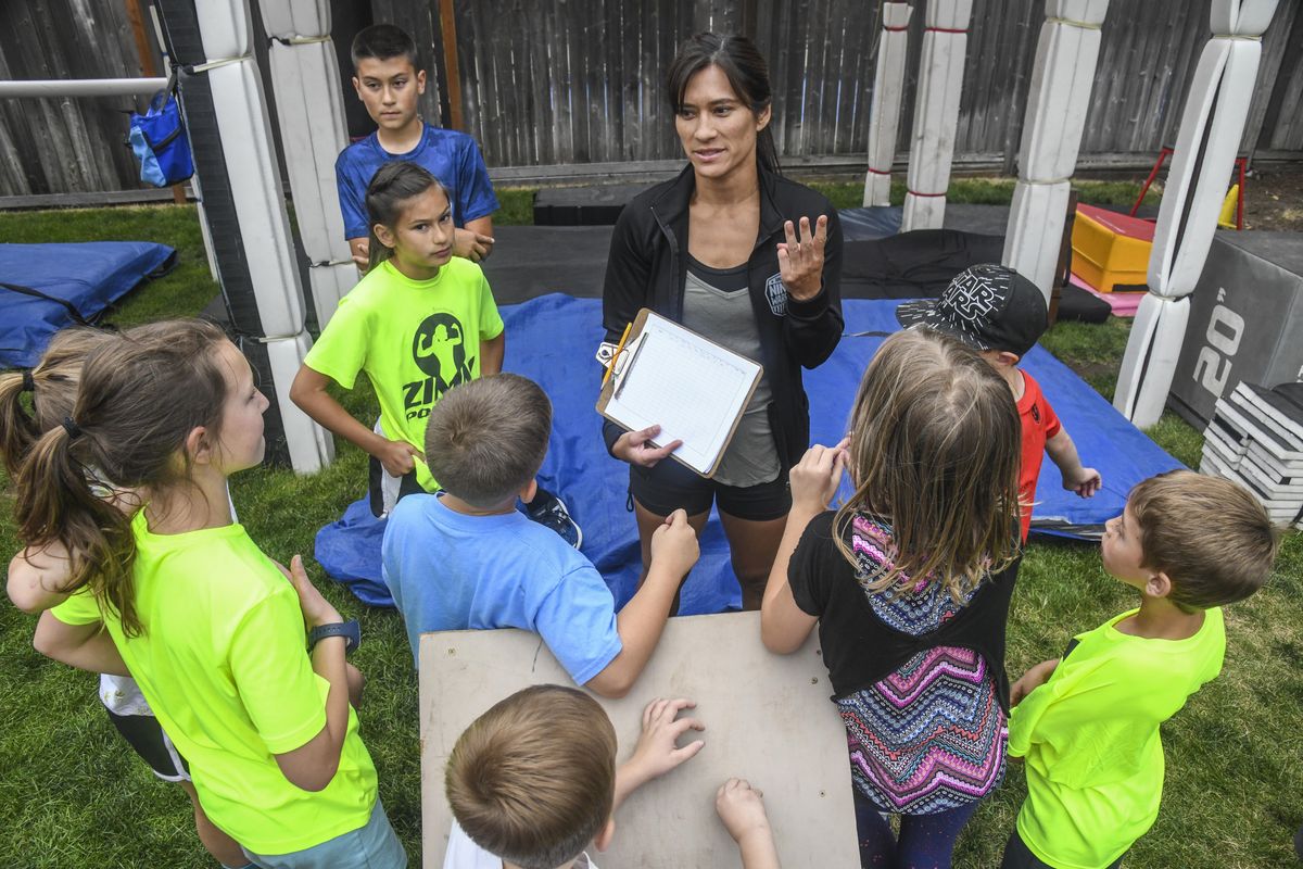 American Ninja Warrior contestant Sandy Zimmerman leads the Little Ninjas class in her backyard, Thursday, June 28, 2018, in Spokane Wash. (Dan Pelle / The Spokesman-Review)
