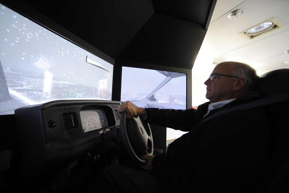 Liberty Lake Mayor Steve Peterson takes a turn on a driving simulator. (Jesse Tinsley)