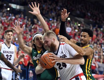 San Francisco forwards Matt McCarthy (left) and Nate Renfro try to keep Gonzaga center Przemek Karnowski (24) out of the key during the first half of an NCAA basketball game, Thurs., Feb. 16, 2017, in the McCarthey Athletic Center. (Colin Mulvany / The Spokesman-Review)