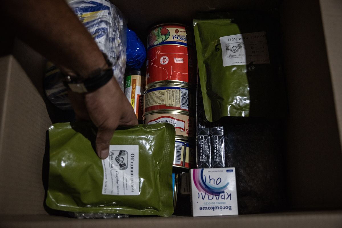 Soldiers prepare packages to be delivered by drone to frontline soldiers. (Ed Ram/For The Washington Post)