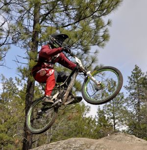 Downhill mountain bikers favor special courses with banked turns and jumps. (Rich Landers)