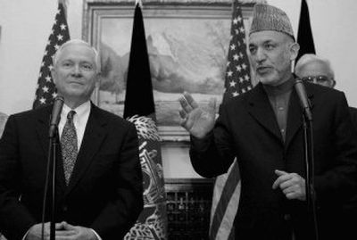 
In his first visit to Afghanistan since his appointment, U.S. Defense Secretary Robert Gates, left, attends a news conference with Afghan President Hamid Karzai  in Kabul  on Tuesday. 
 (Associated Press / The Spokesman-Review)