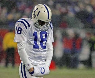 
Indianapolis Colts quarterback Peyton Manning walks off the field during the first half, after scoring only three points. 
 (Associated Press / The Spokesman-Review)