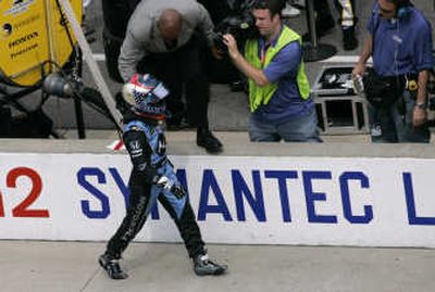 
Danica Patrick walks toward Ryan Briscoe's pit after a collision between the two drivers during the Indianapolis 500. Associated Press
 (Associated Press / The Spokesman-Review)