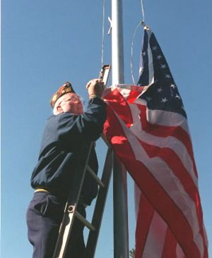 In this Nov. 11, 1999, SR file photo, Jim Shepperd sees to it that Old Glory flies in Coeur d'Alene all year-round. (Jesse Tinsley/SR file photo)