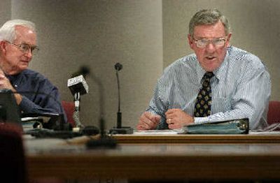 
Retired judge Philip A. Thompson, right, expresses his irritation Friday about news stories describing his links with Spokane Mayor Jim West. Thompson was at a meeting of the city panel charged with investigating West. At left is retired judge Harold 