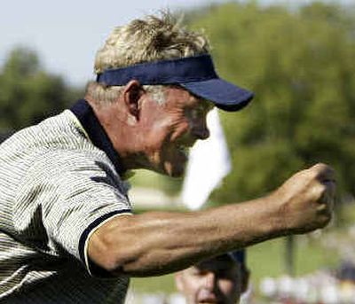 
Europe's Darren Clarke reacts after sinking a putt on the 17th hole to square his match with American Davis Love III. 
 (Associated Press / The Spokesman-Review)