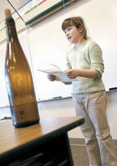 
Hannah Gauntz, 9, a fourth-grader at Lewis and Clark Elementary School, reads a letter found in a bottle to her class Tuesday in Astoria, Ore., during show-and-tell. 
 (Associated Press / The Spokesman-Review)