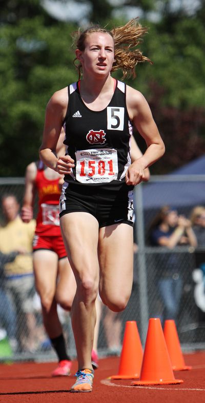 North Central's Katie Knight leads the pack down the home stretch of the State 3A girls 1,600-meter run in Tacoma on Saturday. Knight won the event two days after also winning the title in the 3,200 meters.  (Patrick Hagerty / Special to The S-R)