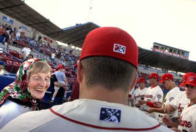 
Arlene Milward makes the most of the Spokane Indians' opener against the Eugene Emeralds by getting autographs of her favorite players at Avista Stadium.
 (Photos by Jed Conklin / The Spokesman-Review)