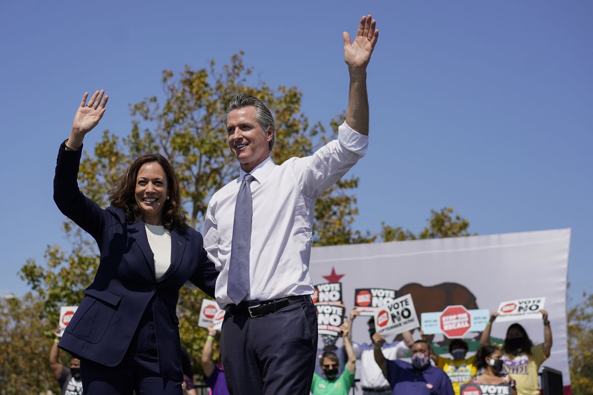 Vice President Kamala Harris stands on stage with California Gov. Gavin Newsom at the conclusion of an event at the IBEW-NECA Joint Apprenticeship Training Center in San Leandro, Calif., Wednesday, Sept. 8, 2021.  (Carolyn Kaster)