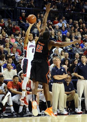 Gonzaga’s Silas Melson shoots over Pacific’s Eric Thompson for one of his four 3-pointers. (James Snook)
