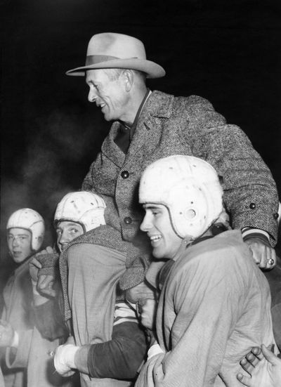 Gonzaga Prep football coach Billy Frazier is carried off the field by his players in 1952. (The Spokesman-Review archives)