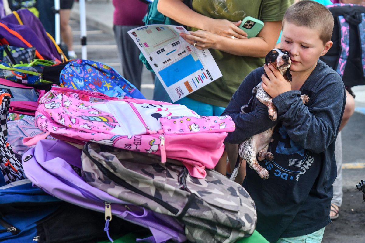 Families at Salvation Army backpack giveaway hopeful for new school year The Spokesman Review