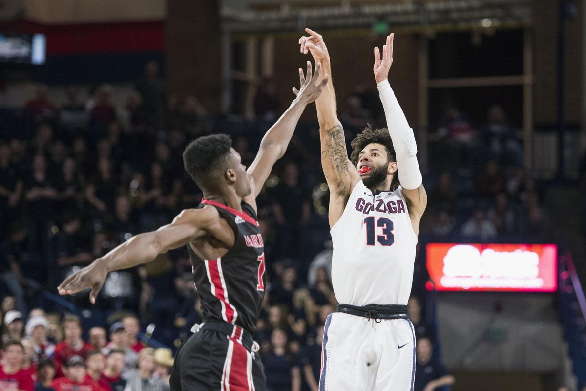 Gonzaga guard Josh Perkins launches a 3-point shot over Incarnate Word guard Keaton Hervey, Wednesday, Nov 29, 2017, in the McCarthey Athletic center. (Dan Pelle / The Spokesman-Review)