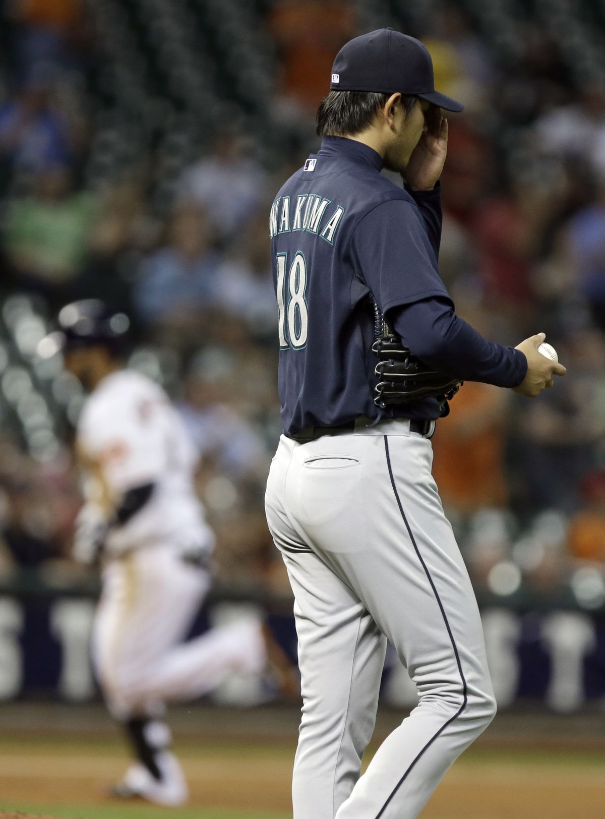 Seattle starting pitcher Hisashi Iwakuma regroups after a solo home run by Houston’s Marwin Gonzalez. (Associated Press)