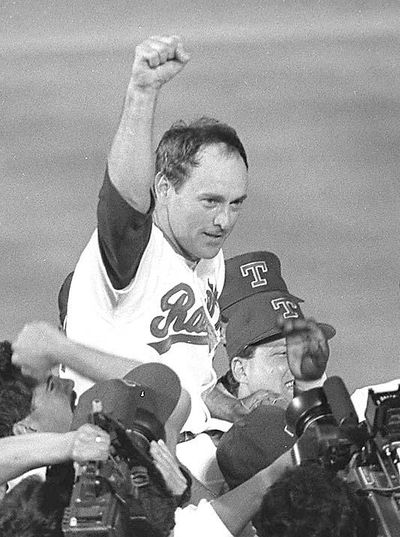 Texas Rangers pitcher Nolan Ryan is carried off the field by his teammates May 1,1991 after throwing an unprecedented seventh no-hitter against the the Toronto Blue Jays in Arlington, Texas. (BILL JANSCHA / Associated Press)