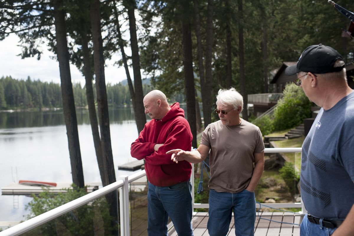 Sacheen Lake residents Dave Swimelar, left, Rich Prange and Jeff Storms discuss the lake’s water quality. Prange has installed his own septic system.