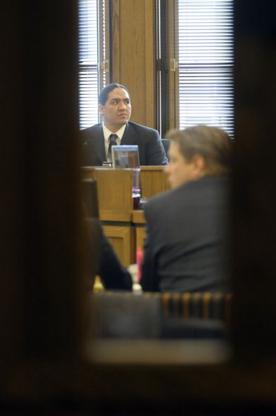 Shonto Pete  takes the witness stand Monday in the trial of Spokane police Officer Jay Olsen, at right.  (CHRISTOPHER ANDERSON / The Spokesman-Review)