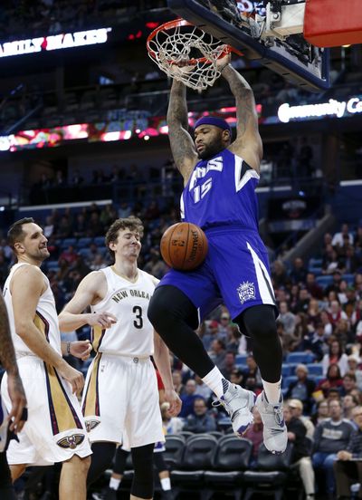 Sacramento Kings center DeMarcus Cousins, right, was displeased with an upcoming promotional giveaway. (Gerald Herbert / Associated Press)