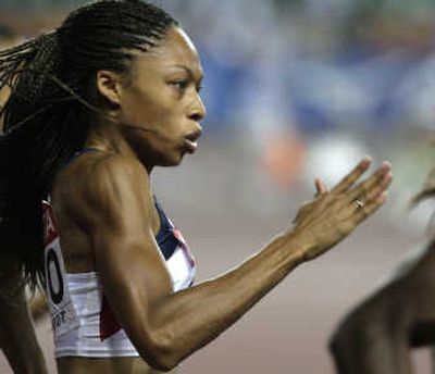 
Allyson Felix turned heads with her blistering first-place finish in the 200 meters at the world track and field championships. Associated Press
 (Associated Press / The Spokesman-Review)