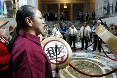 
Vincent Penn, left, a member of the Quileute tribe,  joins members of the Sto:lo Nation and the Makah tribes in a healing circle Wednesday in the Capitol Rotunda. The ceremony was held in remembrance of a 14-year-old Indian boy who was lynched 120 years ago just across the Washington border in Canada by a Washington Territory mob. 
 (Associated Press / The Spokesman-Review)