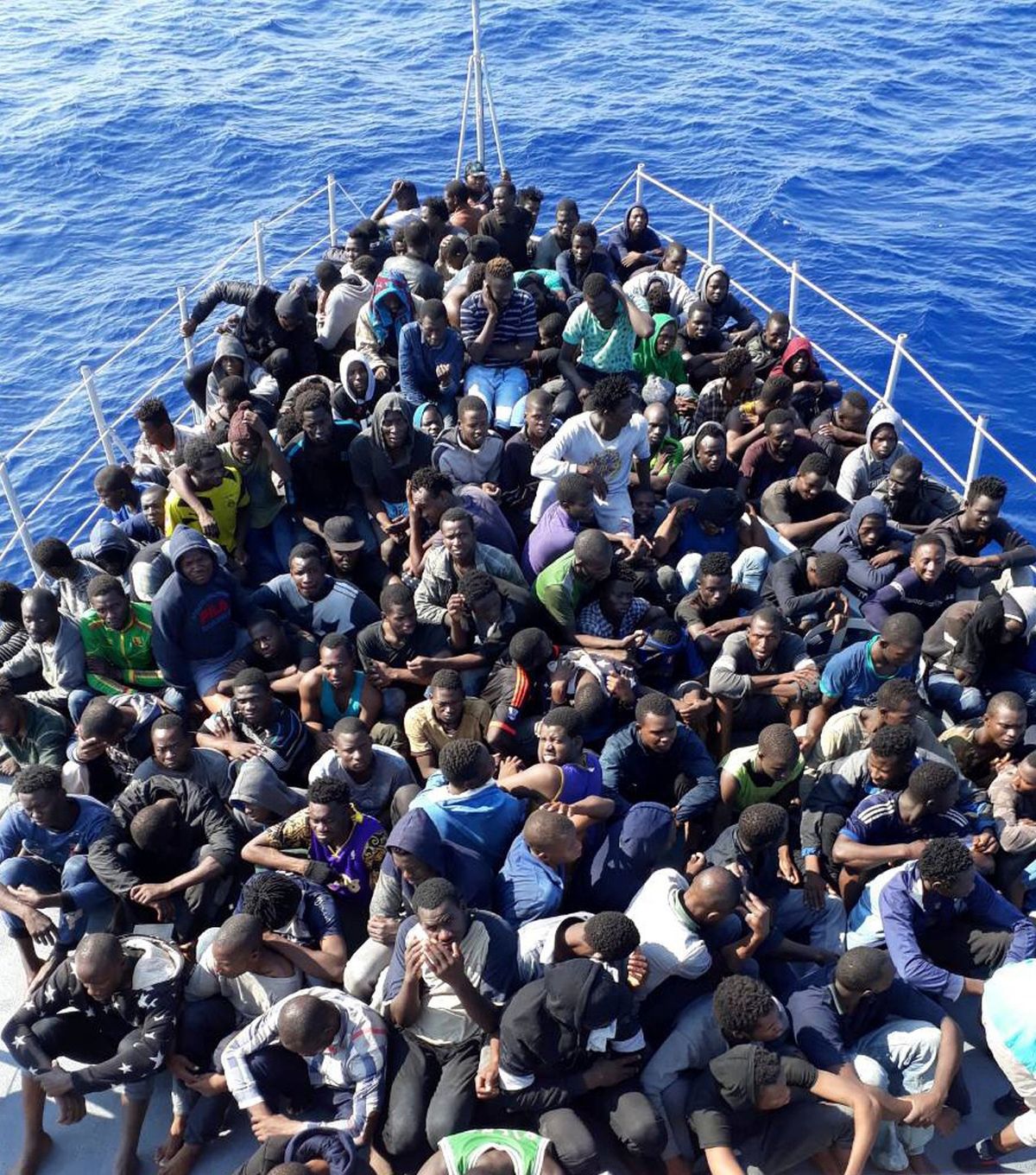 FILE - In this photo released by the Libyan coast guard, African migrants who were on boats in distress in the Mediterranean on their way to Europe, and rescued by the Libyan coast guard arrive to shore, east of the capital, Tripoli, Libya June 24, 2018. A confidential European Union military report calls for the continued support and training of Libya’s coastguard and navy despite concerns about their treatment of migrants, a mounting death toll at sea, and the continued lack of any central authority in the North African nation. The report circulated to EU officials on Jan. 4 and obtained by The Associated Press offers a rare insight into Europe’s determination to cooperate with Libya and its role in the interception and return of thousands of men, women and children to a country where they face insufferable abuse.  (Libyan coast guard)