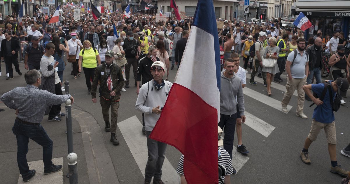 French virus health pass in full use but protests keep going The