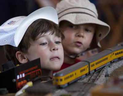 On the right side of the tracks: Jack Cornell, 5, left, and Reid Eichberg, 5, both of Boise, watch in fascination as a scale model train moves along a table at the Boise Depot on Sunday. The Union Pacific Railroad celebrated its 150th year with a stop at the Boise Depot and a declaration marking Boise as one of its “train towns.” Hundreds of railroad enthusiasts and history buffs gathered at the depot to see a sleek Union Pacific passenger train carrying the Promontory museum car. A scale version of the train gave rides to families, and model train displays and other curiosities filled the historic Boise Depot. (Darin Oswald)