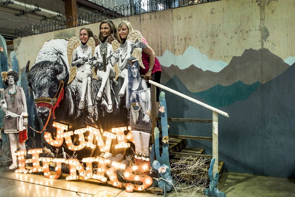 Posing with the Junk Hunks display from left is Brenna Collier, Terrin Utter and Krissy McLitus during The Farm Chicks Vintage And Handmade Fair at the Spokane County Fair and Expo Center on Sunday, June 4, 2017. (Kathy Plonka / The Spokesman-Review)