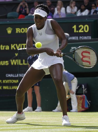 Five-time Wimbledon champ Venus Williams was knocked out by No. 6 Petra Kvitova on Friday. (Associated Press)