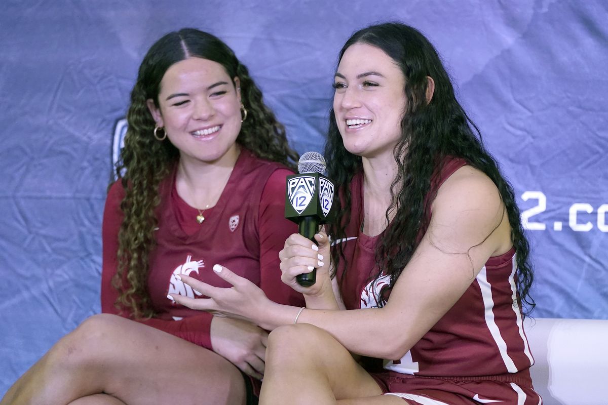 Washington State’s Krystal Leger-Walker, right, speaks next to sister Charlisse Leger-Walker during the Pac-12 Conference women’s basketball media day Tuesday in San Francisco.  (Jeff Chiu)