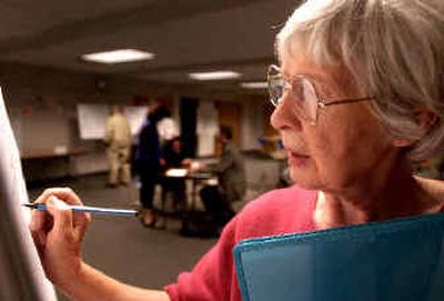 
Lois Harger of Spokane Valley writes her comments on a flip chart during an open house Thursday at the Valley library branch. Lois Harger of Spokane Valley writes her comments on a flip chart during an open house Thursday at the Valley library branch. 
 (Holly Pickett/Holly Pickett/ / The Spokesman-Review)