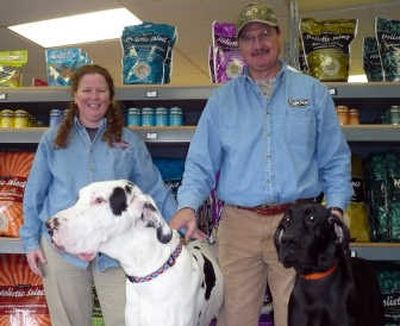 
Pamela and John Cales stand with their Great Dane pups, B.J. and Kuro, at K-9 Kabin in Rathdrum. 
 (JACOB LIVINGSTON / The Spokesman-Review)